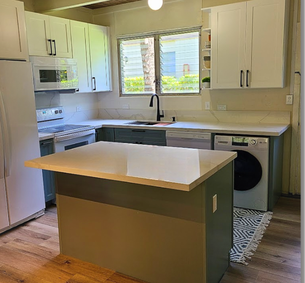 Image of kitchen remodel with white cabinets and quartz