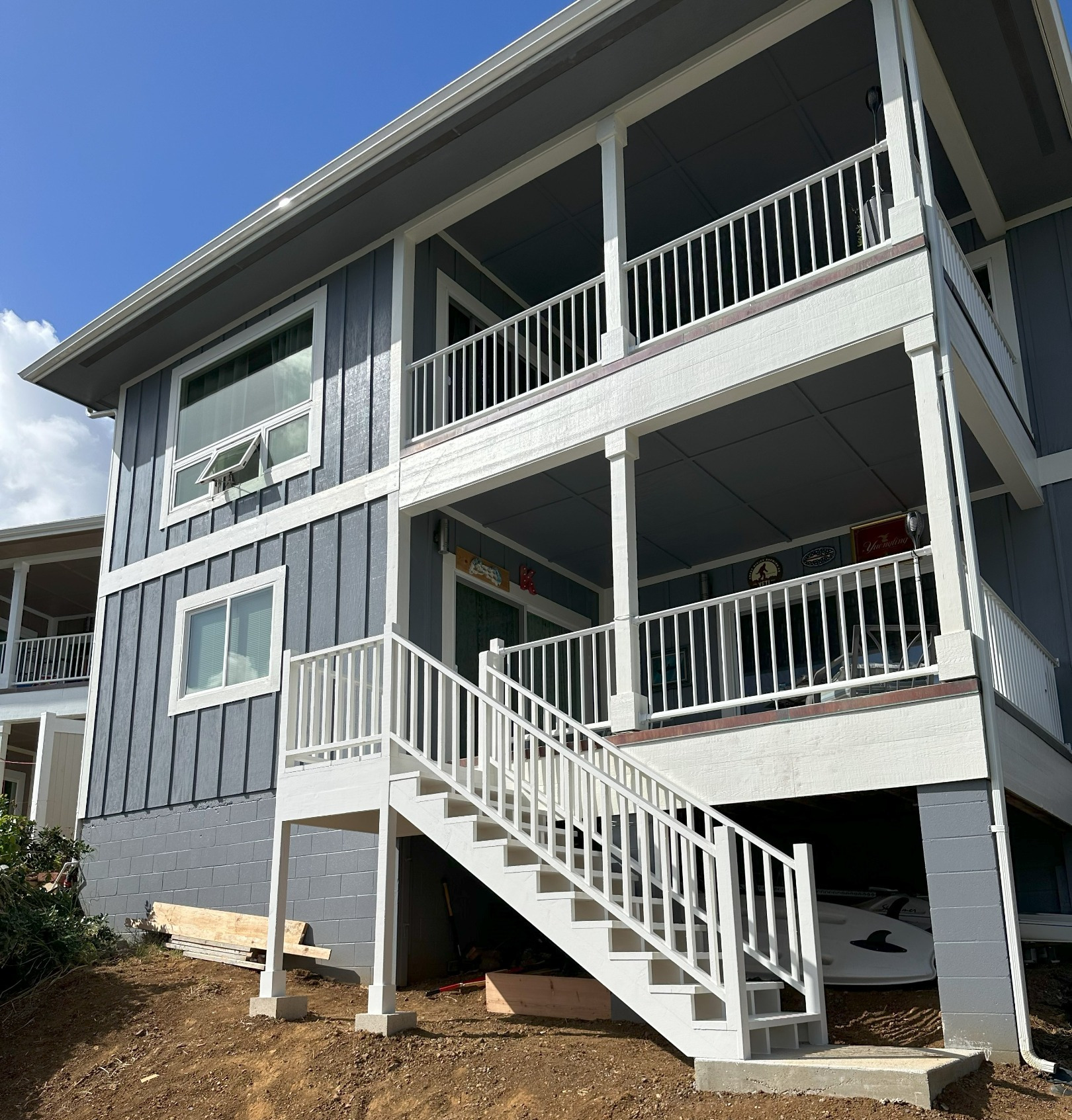 House with stairs addition painted white