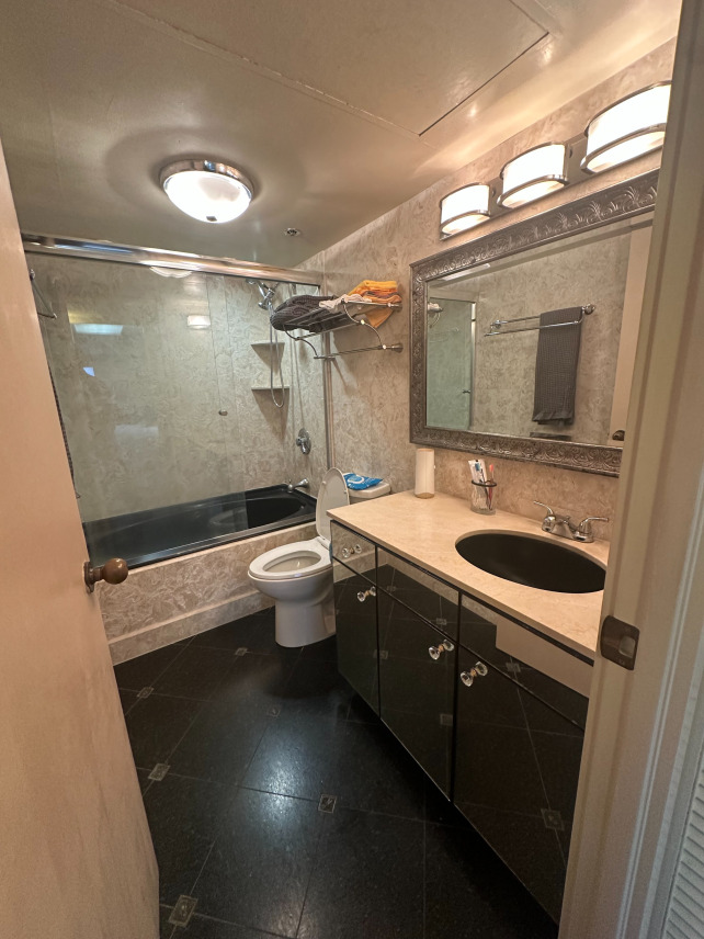 Before photo showing outdated bathroom in Honolulu