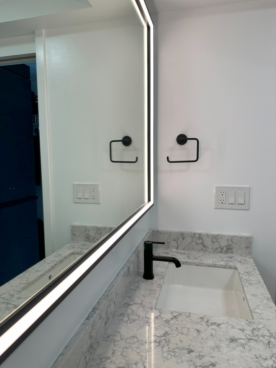 Light up mirror in custom bathroom