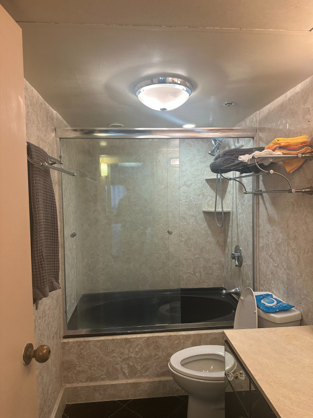 Before photo showing outdated bathroom in Honolulu