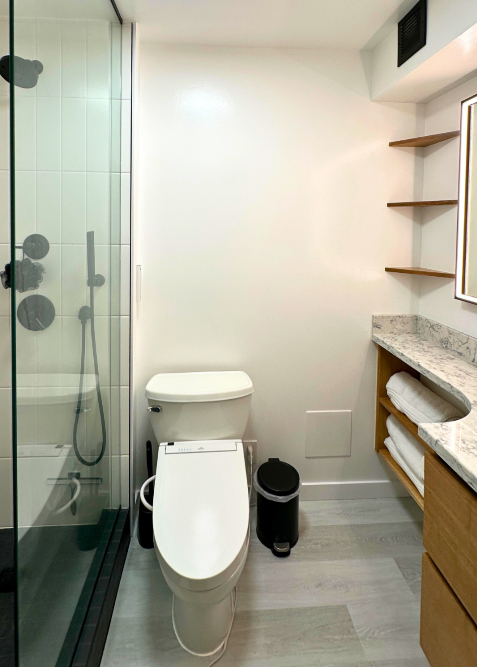 Remodeld bathroom with oak finishes